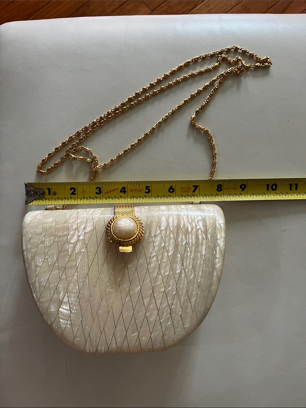 Gold-Chain Ivory Shell Evening Clutching with class!